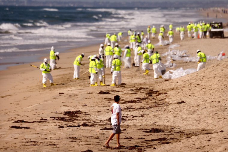 Image: Amid Oil Spill, Californians Return To Local Beaches