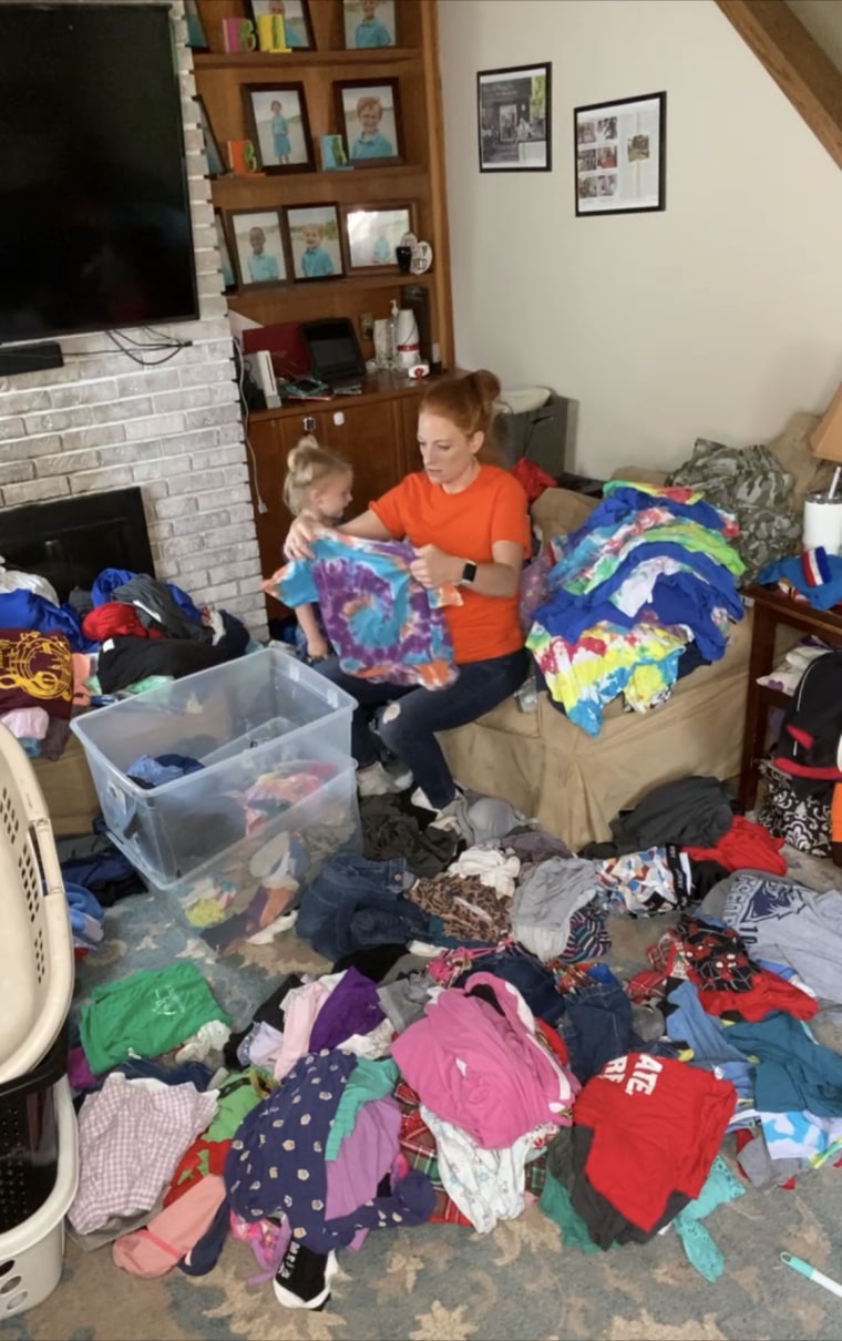 Alicia Dougherty folding her 10 kids' laundry during the pandemic.