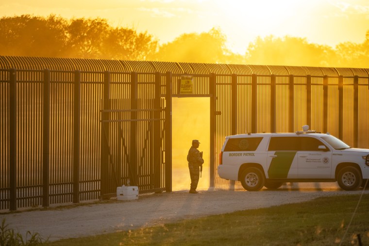 A U.S. Border Patrol vehicle drives through a gate in the border fence after U.S. Customs and Border Protection closed the point of entry with Mexico on Sept. 17, 2021, in Del Rio, Texas.