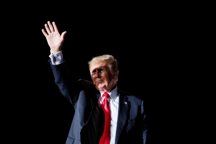Former President Donald Trump waves after his speech during a rally at the Iowa States Fairgrounds in Des Moines on Oct. 9, 2021.