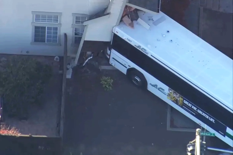 Image: An AC Transit bus crashing into a home in Oakland Friday afternoon, injuring eight, the California Highway Patrol said.