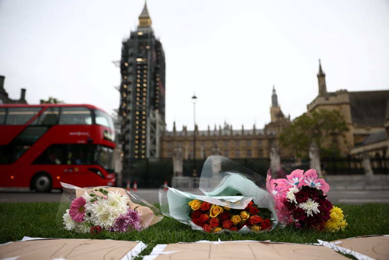 Image: Floral tributes to killed British MP Amess outside parliament in London