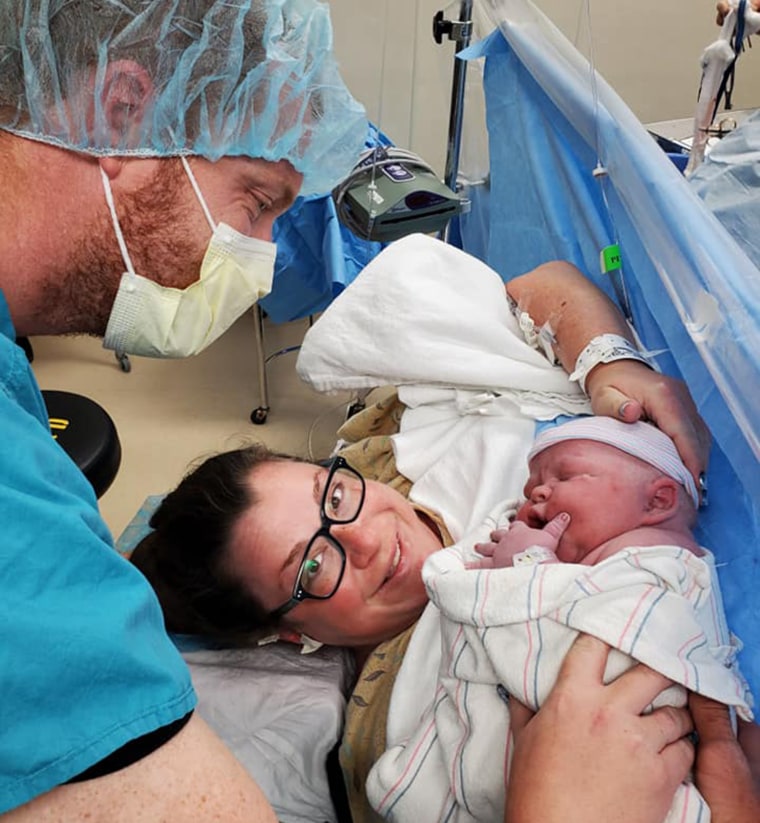 Cary and Tim Patonai posed in the delivery room with their son Finnley. 