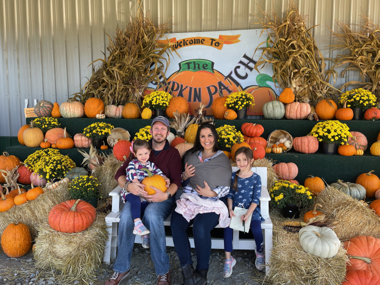 Kristin and Nick Lammert with their three daughters, all born on the same day. 