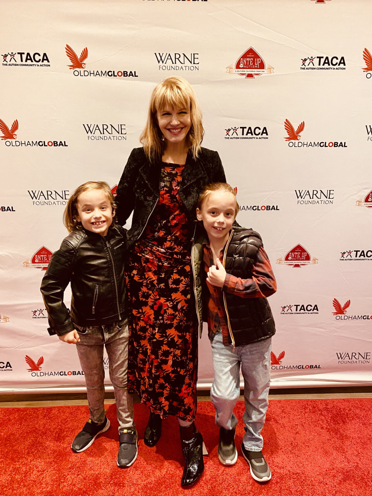 Actor Kathryn Morris smiles on the red carpet with her twin boys.