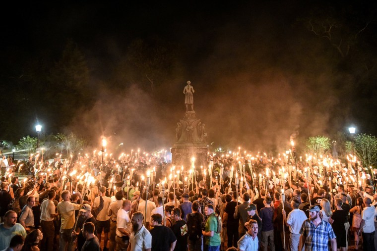 Image: White nationalists participate in a torch-lit march on the grounds of the University of Virginia ahead of the Unite the Right Rally in Charlottesville, Virginia