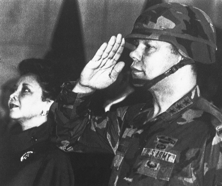Image: U.S. Lieutenant General Colin Powell, commander of the 5th U.S. corps, salutes while his wife Alma looks on during a farewell ceremony in Frankfurt, Germany.