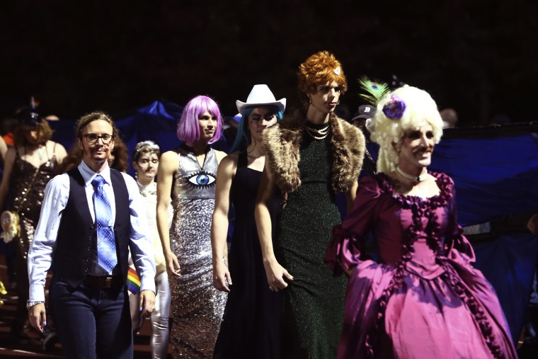 People participate in the "drag ball" halftime show at Burlington High School on Friday, Oct. 15, 2021, in Burlington, Vt.  The event was part of that school's homecoming and was sponsored by the Gender Sexuality Alliance from Burlington and South Burling