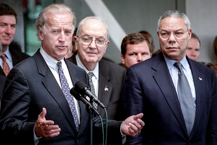 SenJoe Biden, D-Del., addresses reporters as Sen. Jesse Helms, R-N.C., center, and Secretary of State Colin Powell look on after meetings Oct. 3, 2001, at the State Department in Washington, DC.