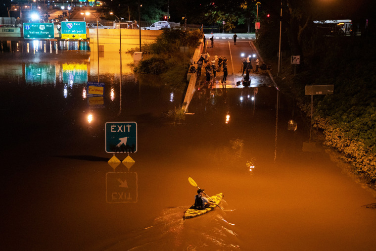 A kayaker paddles down a portion of Interstate 676 after flooding from heavy rains from hurricane Ida in Philadelphia on Sept. 2, 2021.
