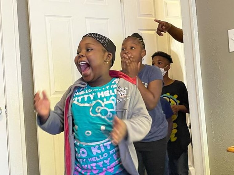 Kids in Detroit touring their new home created by Humble Design.