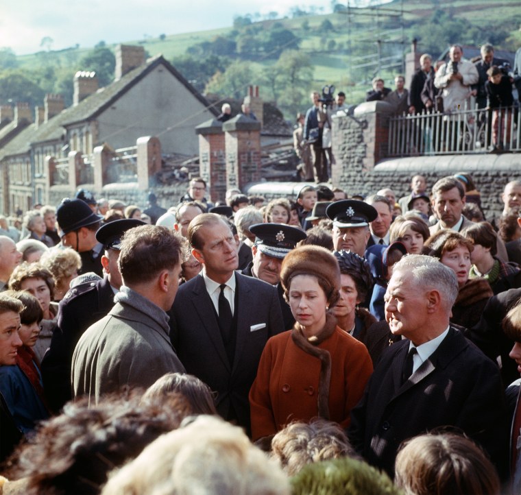 Queen Elizabeth II visits the coal mining village of Aberfan in Wales, following the disaster which resulted in the deaths of 116 children and 28 adults, on Oct. 29, 1966.
