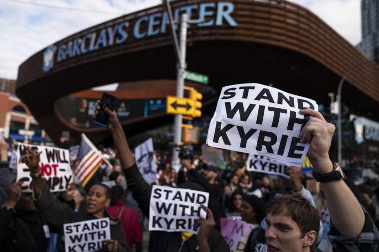Protesters rallying against Covid-19 vaccination mandates and in support of basketball player Kyrie Irving gather outside the Barclays Center before an NBA basketball game between the Brooklyn Nets and the Charlotte Hornets on Oct. 24, 2021, in New York.