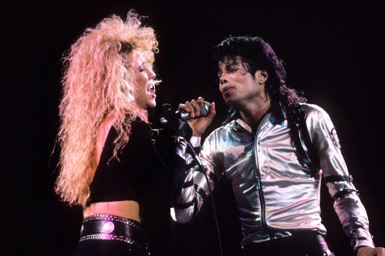 Sheryl Crow performs with Michael Jackson