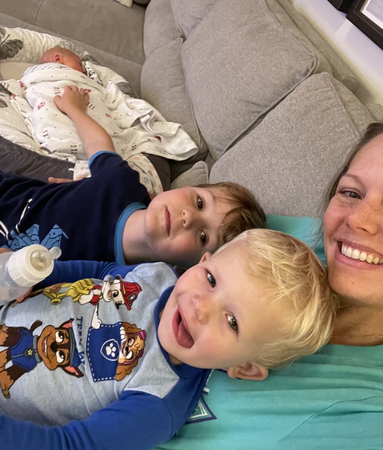 Dylan and her boys snuggle on the couch.