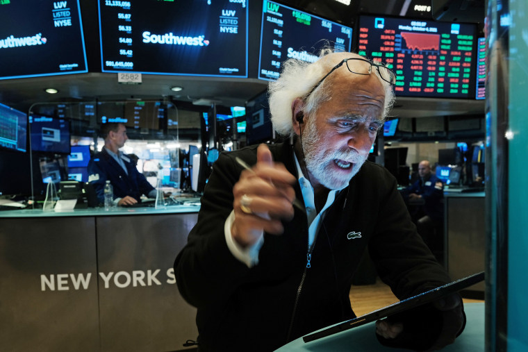 Traders work on the floor of the New York Stock Exchange on Oct. 4, 2021.