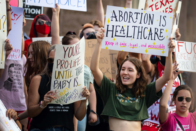 Demonstrators rally against anti-abortion and voter suppression laws on Oct. 2, 2021, in Austin, Texas.