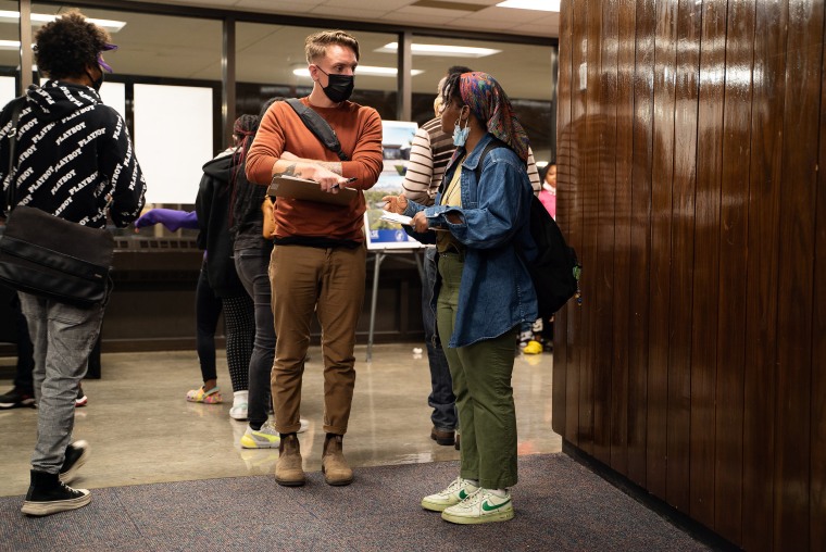 Image: Yes 4 Minneapolis canvassers stand outside North High School auditorium in Minneapolis on Oct. 12, 2021.