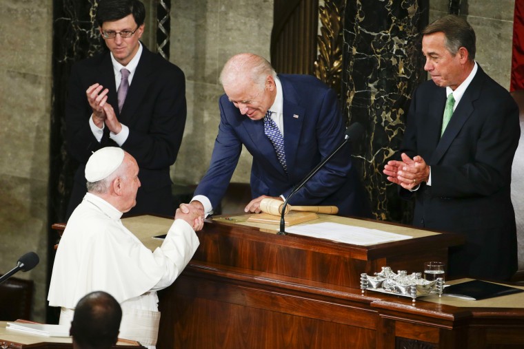 Then-Vice President Joe Biden shakes hands with Pope Francis on Capitol Hill on Sept. 24, 2015.