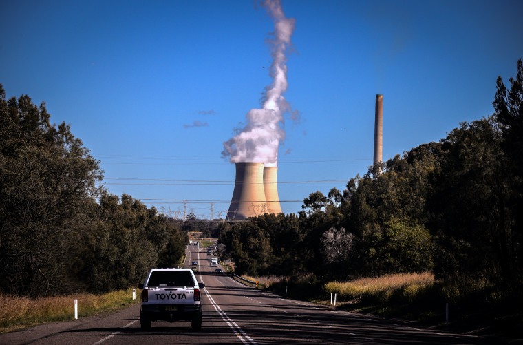 Smoke and steam rises from the Bayswater coal-powered thermal power station located near the central New South Wales town of Muswellbrook