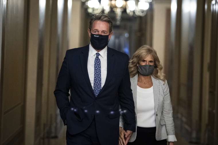 Former Sen. Jeff Flake, R-Ariz., nominee to be ambassador to Turkey, and his wife Cheryl, are seen in the U.S. Capitol on Oct. 19, 2021.