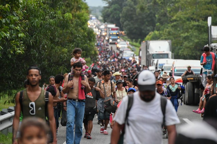 Migrants heading in a caravan to the U.S. walk towards Mexico City to request asylum and refugee status in Villa Comaltitlan, Chiapas State, Mexico, on Oct. 28, 2021.