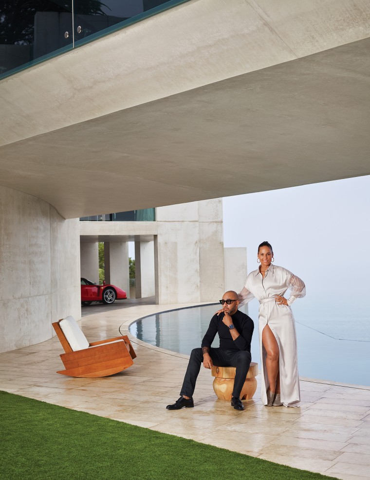 Alicia Keys and Kasseem Dean (aka Swizz Beatz) pose on their sleek pool terrace.