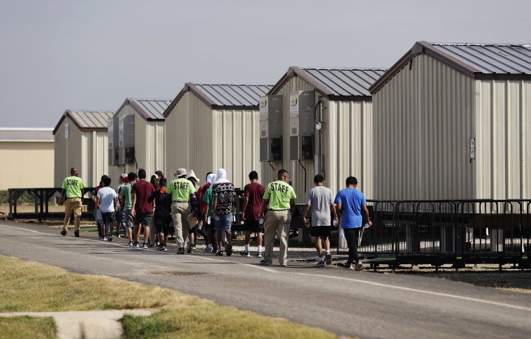 Image: Staff escort immigrants to class at the U.S. government's holding center for migrant children in Carrizo Springs, Texas, on July 9, 2019.