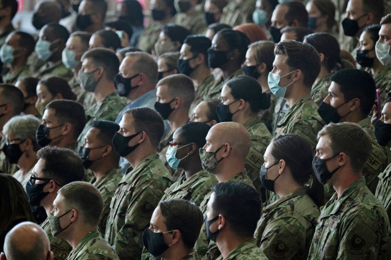 U.S. Air Force personnel and their families stationed at Royal Air Force Mildenhall listen to President Joe Biden's address in Suffolk, England on June 9, 2021.