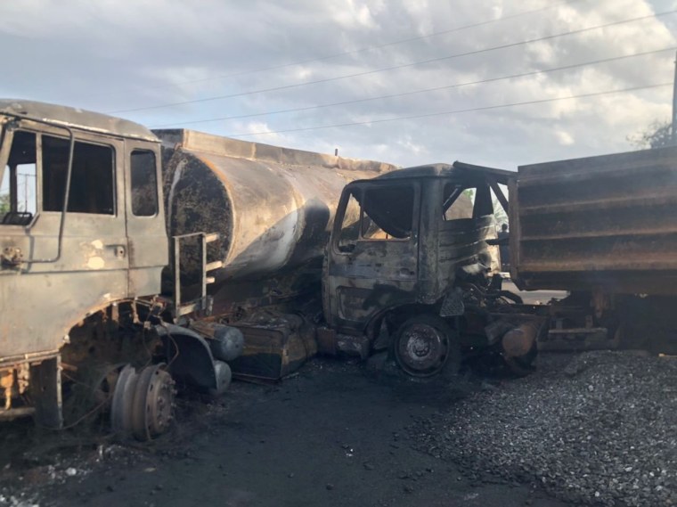 Image: Burnt collided trucks are pictured after a fuel tanker explosion in Freetown