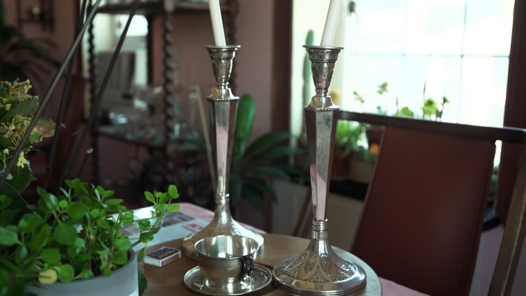 Zimbler still has the Shabbat candlesticks that survived the raid of her family's apartment as a young girl.