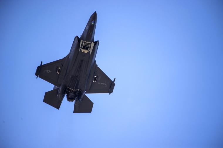 Image: A F-35 fighter plane flies over the White House in Washington in 2019.