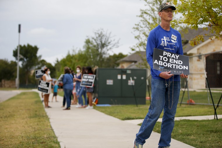 Timothy Dougherty and about a dozen other anti-abortion demonstrators protest outside of a Whole Women's Health of North Texas, on Oct. 1, 2021, in McKinney, Texas.