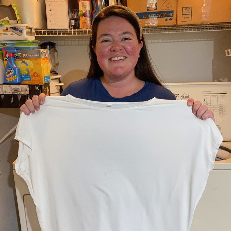 Image of Writer Megan duBois holding up a clean sheet after using Dryer Balls