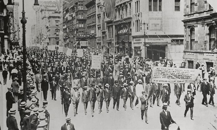 Image: Archival image of people marching at the 1917 Silent Parade in New York.