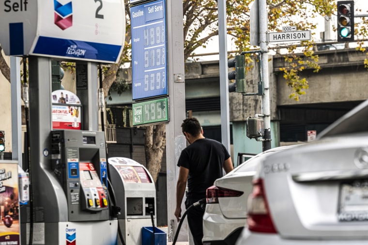 A customer refuels a vehicle at a Chevron gas station in San Francisco on Nov. 15, 2021.