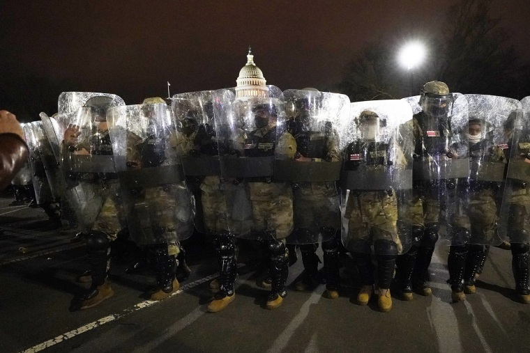 DC National Guard stand outside the Capitol, on Jan. 6, 2021.