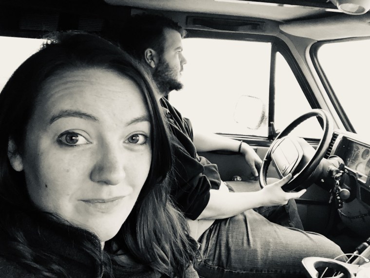 Clara Chapman driving with her husband, Ryan Chapman