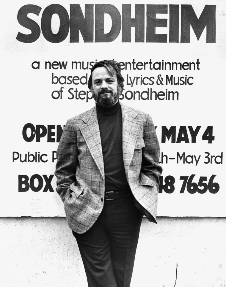 Stephen Sondheim stands beside an advertisement for one of his shows in 1976. 