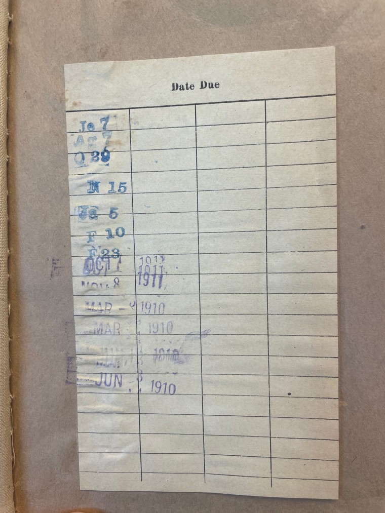 A card shows that the book was last checked out in 1911. 