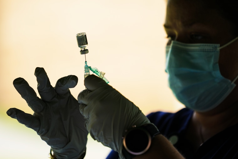 A health worker prepares a Pfizer-BioNTech Covid-19 vaccination dose in Reading, Pa., on Sept. 14 2021.