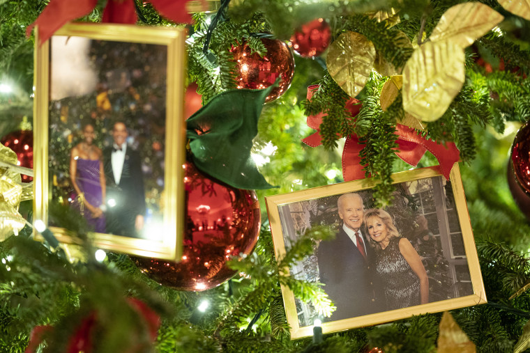 A photo of President Joe Biden and first lady Jill Biden sits in a Christmas tree in the State Dining Room of the White House during a press preview of the White House holiday decorations, Monday, Nov. 29, 2021, in Washington. 