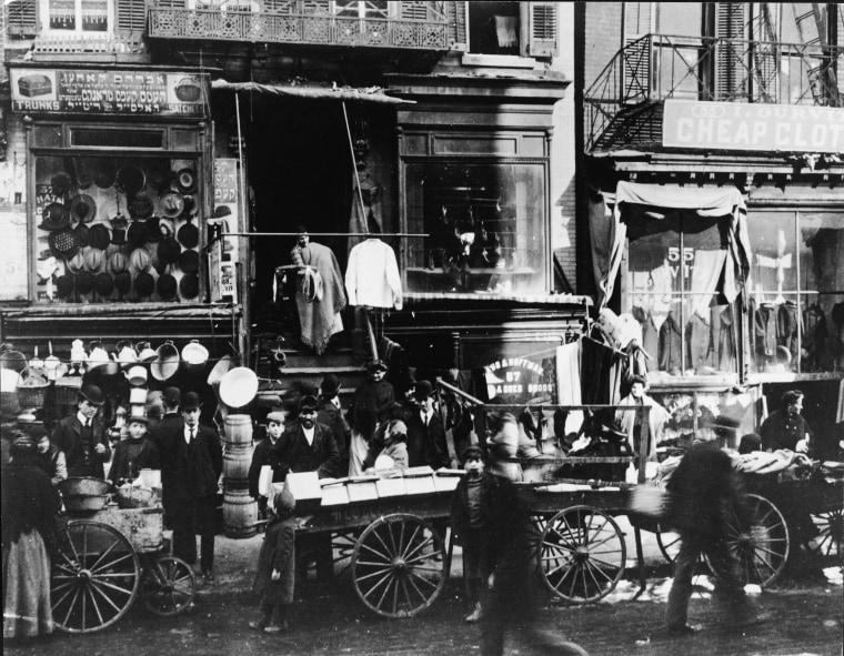 Shoppers visit vendors on the Lower East Side of Manhattan in New York City circa 1900. The area was home to the largest Jewish immigrant population in the U.S. for decades.