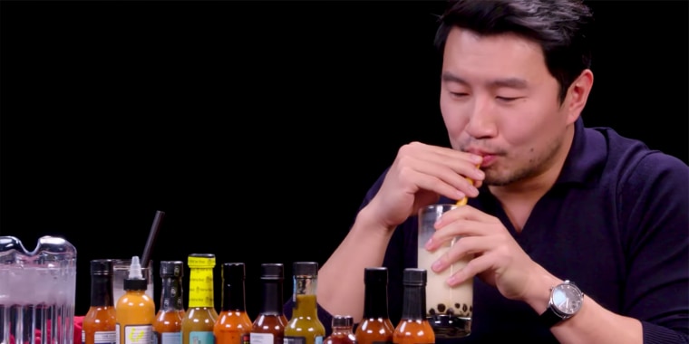 Simu Liu went head-to-head with a plate of hot wings in his latest appearance. 