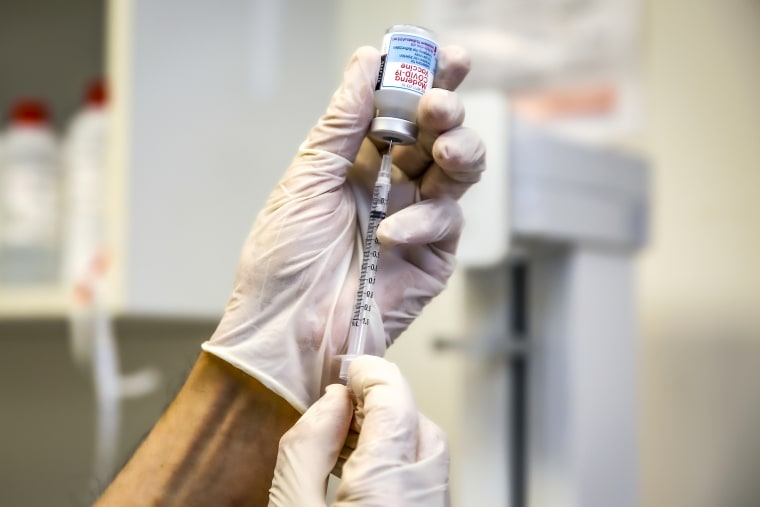 A pharmacy owner prepares the Moderna Covid-19 vaccine at Flintridge Pharmacy on Nov. 16, 2021 in La Canada Flintridge, Calif.