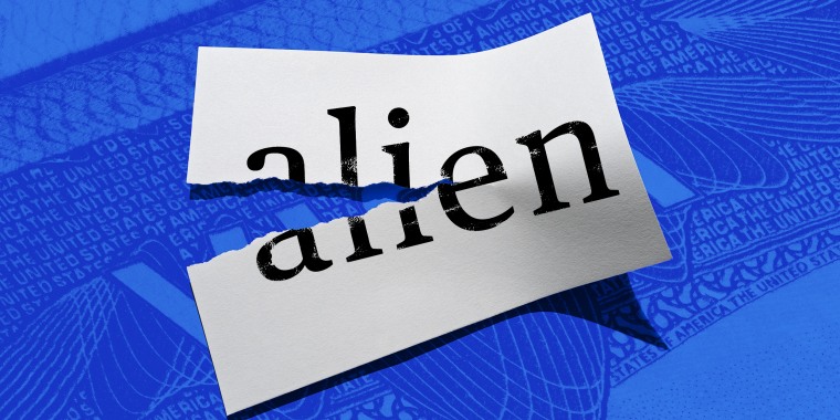 Photo illustration: A half ripped paper with the word \"alien\" on it.