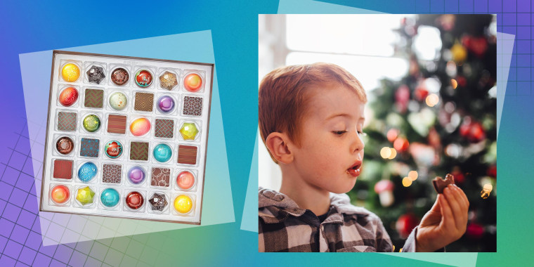 36 Piece Signature Chocolate Collection and a Little boy in his living room on Christmas morning holding a chocolate coin in-between his fingers