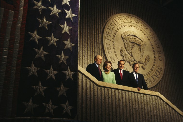 Republican presidential candidate and former Senator of Kansas Bob Dole appears with his wife Elizabeth, former Presidents Gerald Ford, left, and George H.W. Bush during the last days of his campaign on Nov. 1, 1996.