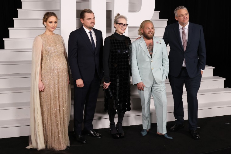 Pregnant Jennifer Lawrence stuns in glittering gold dress