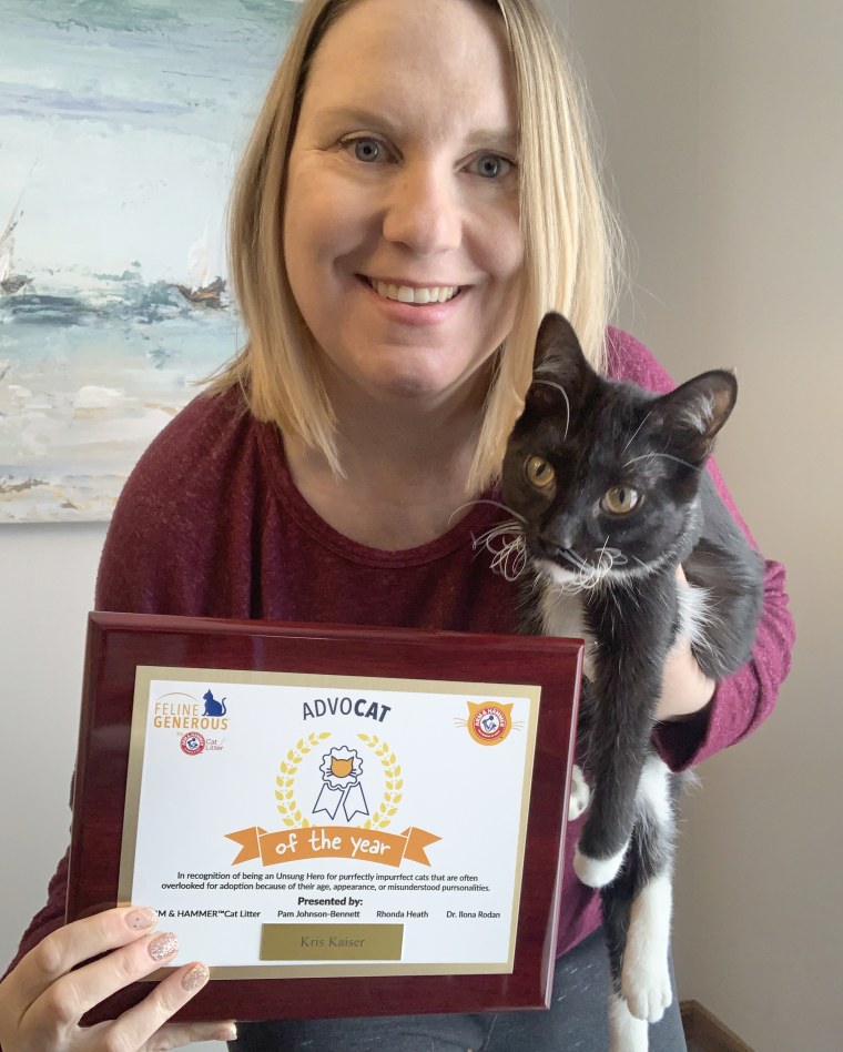 Kris Kaiser holds Snapple and her award.